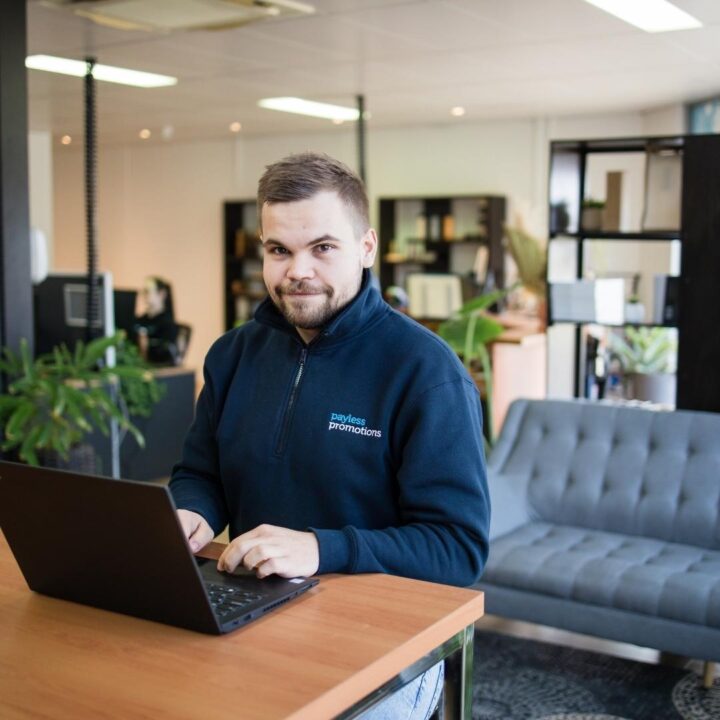 A business student working at a laptop